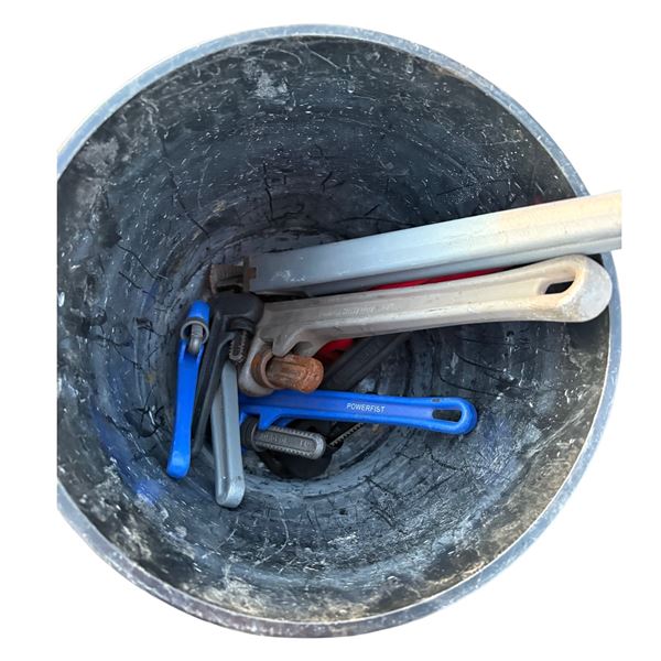 Pail of pipe wrenches