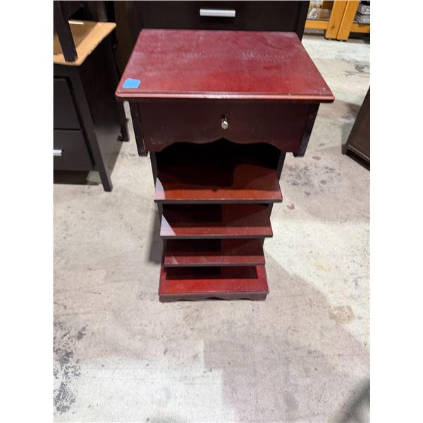 Side table with shelves and a drawer