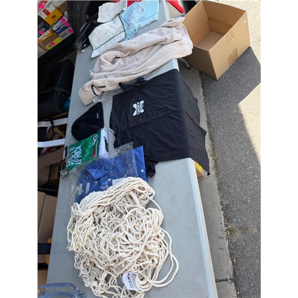 Table linens, shirts, scarf, toque, dress shirt, and hammock