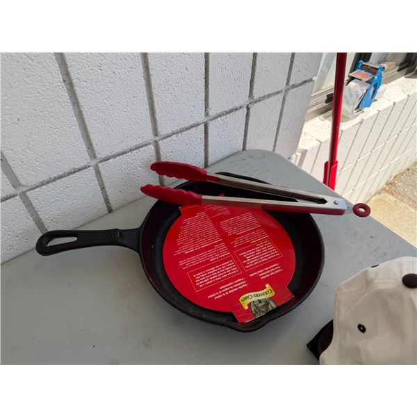 Country cabin, cast-iron, frying pan and tongs