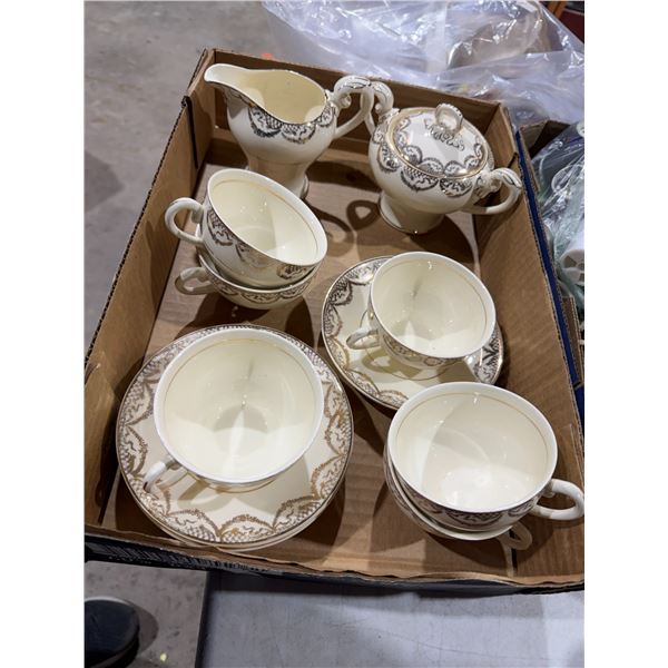 Tea, cups, and saucer, cream, and sugar