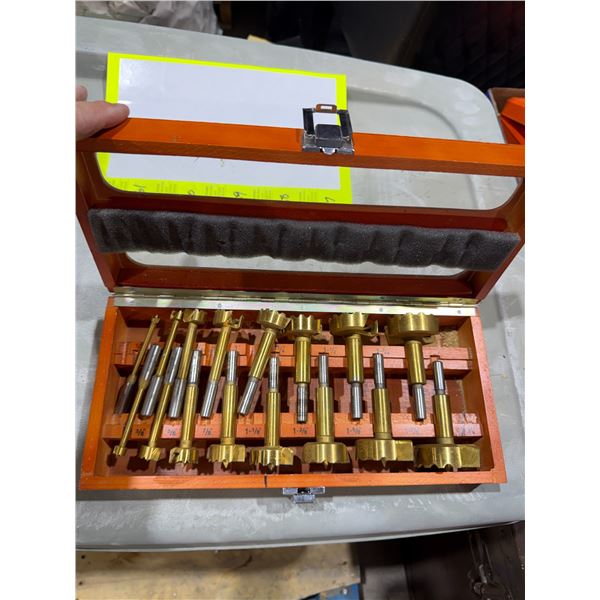 Forstner drill bits housed in a wooden carrying