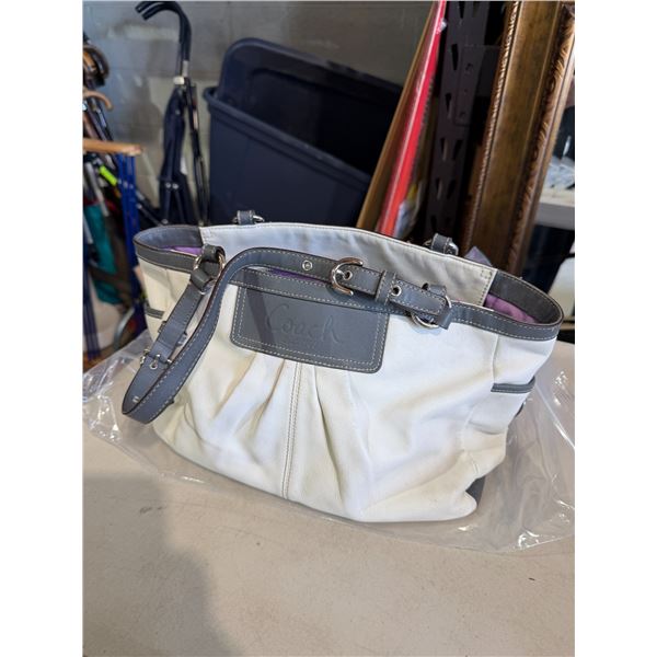 Leather Coach bag consigner says it's authentic authenticity up to the buyer to verify before biddin
