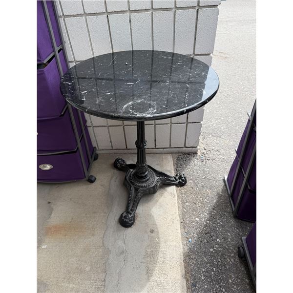 Wrought  iron base pedestal table 23 1/2 inches round 28 inches tall