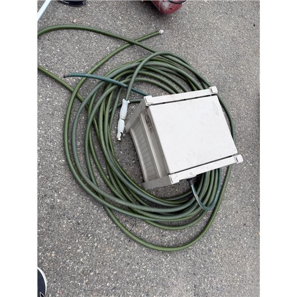 Suncast hose box with a hose
