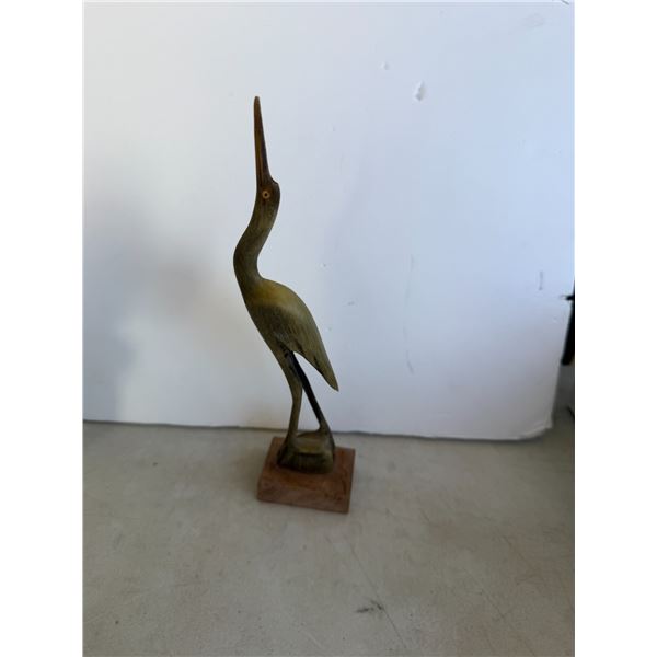 vintage hand-carved water buffalo horn heron figurine mounted on a wooden base.