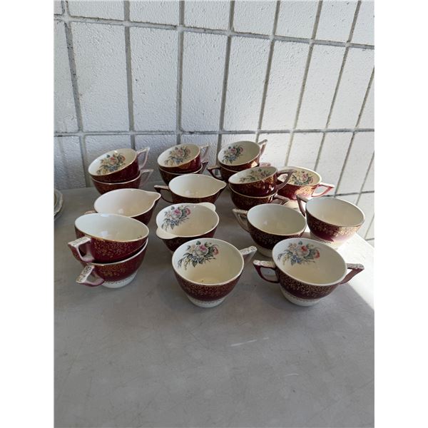 Assorted tea, cups, and creamers and sugar dish