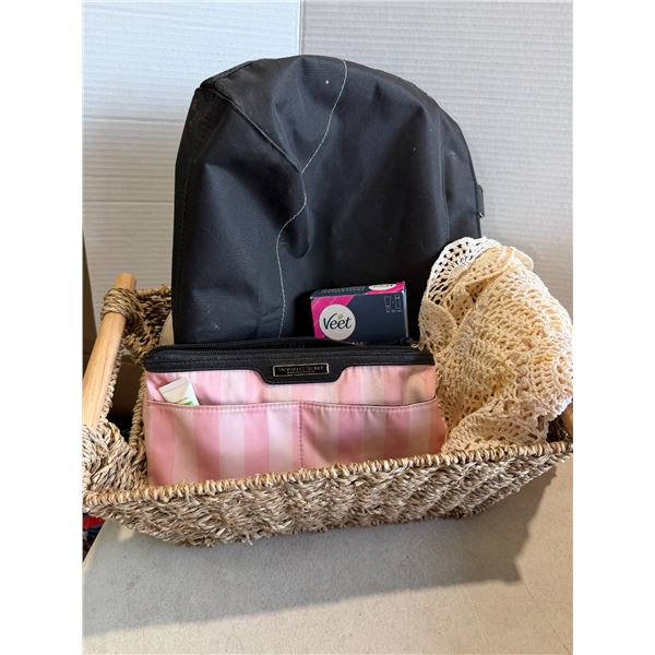Basket, Victoria's Secret makeup bag, and other miscellaneous items