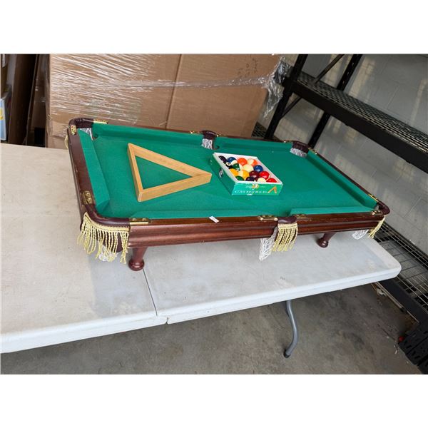 Table top pool table with balls and triangle