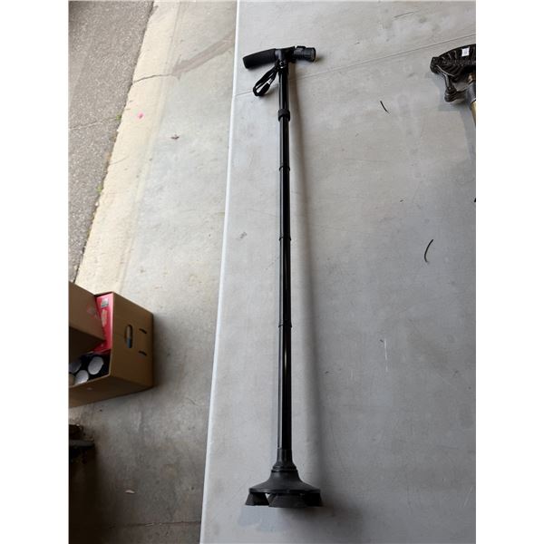 Adjustable cane  with flashlight