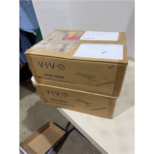 VIVO and one white one black under desk, keyboard trays