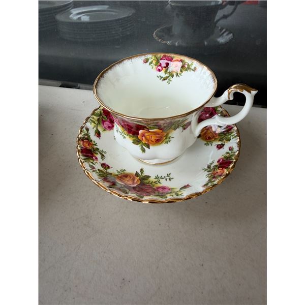 Old country roses, teacup, and saucer