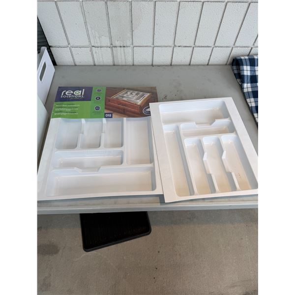 One new and one used cutlery tray