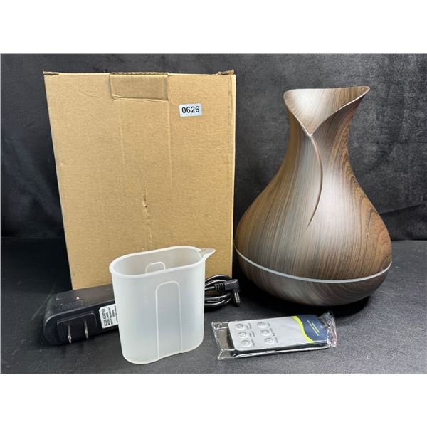 Essential Home Aroma Diffuser with Remote and 7 Essential Oils - New