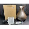 Image 1 : Essential Home Aroma Diffuser with Remote and 7 Essential Oils - New