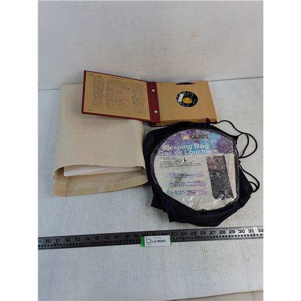 Envelope of Legal Size Printer Paper, Book of 45 Records, Sleeping Bag Storage Tote
