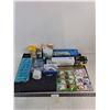 Image 1 : Assorted Sealed/Unused Stock - Bulbs, Travel Steamer, Helping Hand, Poncho, Gift Wrap, Misc.