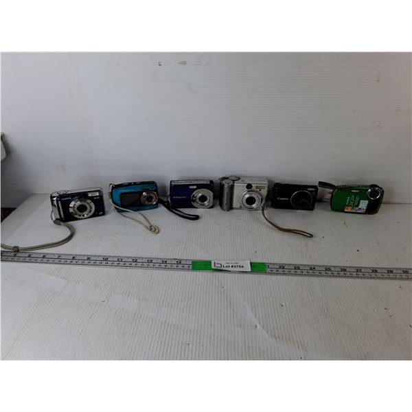 (6) Digital Cameras- Canon, Fujifilm, Polaroid, Misc. One Powers On. May Require Batteries