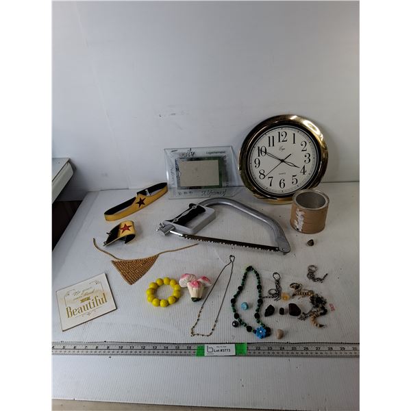 11.25" Wall Clock- Has Crack, Bow Saw, Wonder Woman Head & Wristband, Misc.,