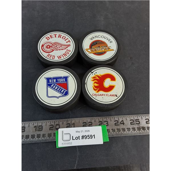 (4) NHL Team Logo Pucks