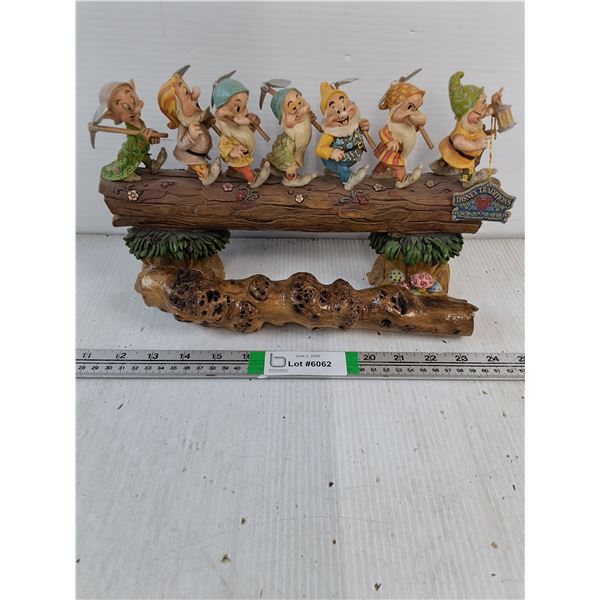 Disney Traditions "Homeward Bound" Featuring the Seven Dwarfs walking along a log, dried branch