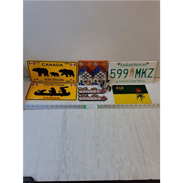 (2) Souvenir Canada Plates,(2) Rubik's Cubes (NIB),(2) Canada Magnets,Saskatchewan Flag and License