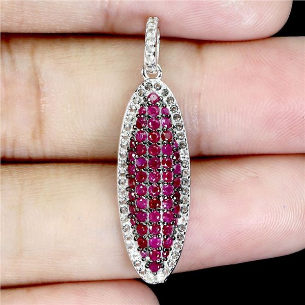 EXCEPTIONAL MYANMAR (BURMA)ROUND DIAMOND CUT RUBY AND WHITE SAPPHIRE PENDANT IN BLACK RHODIUM AND 14