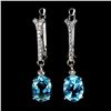 Image 1 : 8X6 OVAL CUT SWISS BLUE TOPAZ EARRINGS IN 14K WHITE GOLD OVER 925 STERLING SILVER