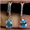 Image 2 : 8X6 OVAL CUT SWISS BLUE TOPAZ EARRINGS IN 14K WHITE GOLD OVER 925 STERLING SILVER