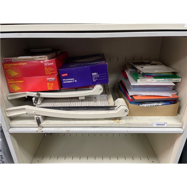 Lot of AssortedÂ Paper Trimmers, Envelopes, and Office Supplies in Storage Cabinet