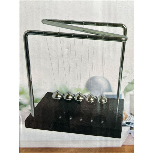 Newton's Cradle Desktop Accessory With Metal Frame and Wooden Base