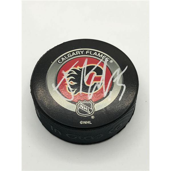 JOHNNY GUDREAU SIGNED CALGARY FLAMES HOCKEY PUCK (ELITE COA)