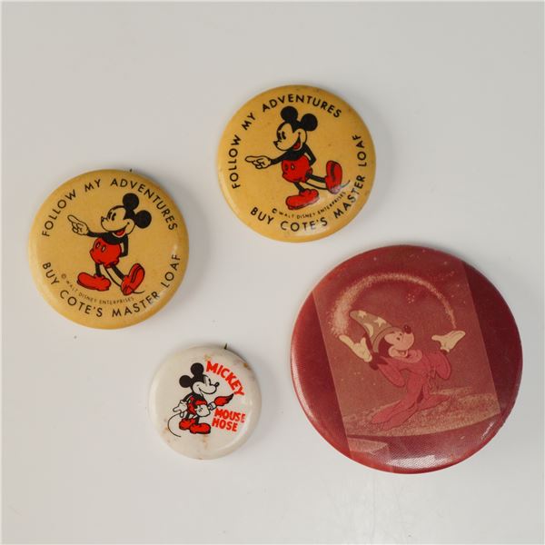 A Collection of Four Vintage Mickey Mouse Pinback Buttons Including Cote's Master Loaf and Fantasia