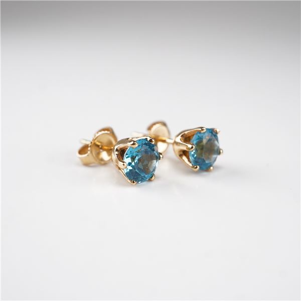 A Pair of 14 Karat Yellow Gold and Blue Topaz Stud Earrings