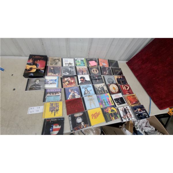 Collection of CDs Including Eagles, ABBA, Saturday Night Fever, Jimmy Buffett, Bob Marley and More