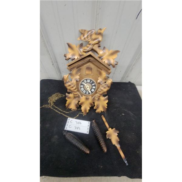 Carved Wood Cuckoo Clock with Pinecone Weights, Pendulum, and Chain German