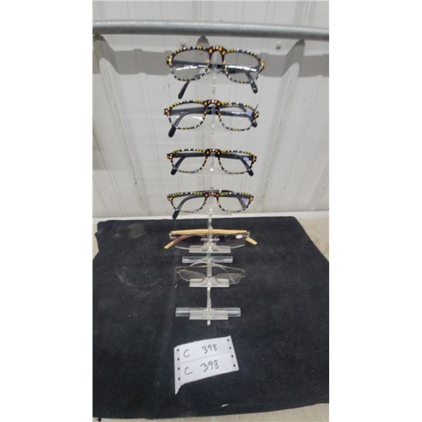 Collection of Seven Pairs of Decorative Reading Eyeglass Frames with Display Stand