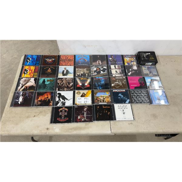 36 Rock and Classic Rock CDs Including AC/DC, Guns N' Roses, and More