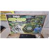 Image 2 : Tyco Nite-Glow 4-Lane Racing Slot Car Set with Track, Controllers, Cars, and More