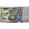 Image 3 : Tyco Nite-Glow 4-Lane Racing Slot Car Set with Track, Controllers, Cars, and More