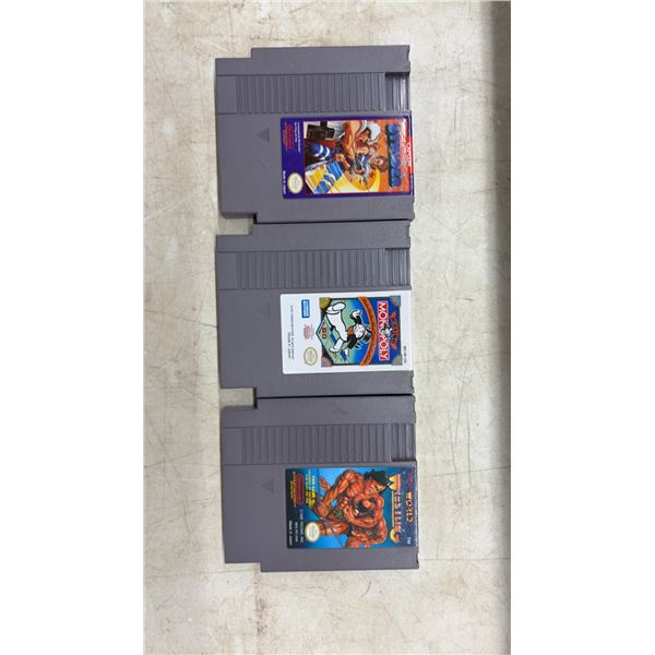 3 NES Game Cartridges: Strider, Monopoly, and Tecmo World Wrestling