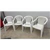 Image 1 : Set of Four White Plastic Patio Armchairs with Slatted Backs