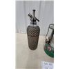 Image 4 : Coleman Model 335 Green Gas Lantern and Vintage Mesh-Wrapped Soda Stezler Bottle