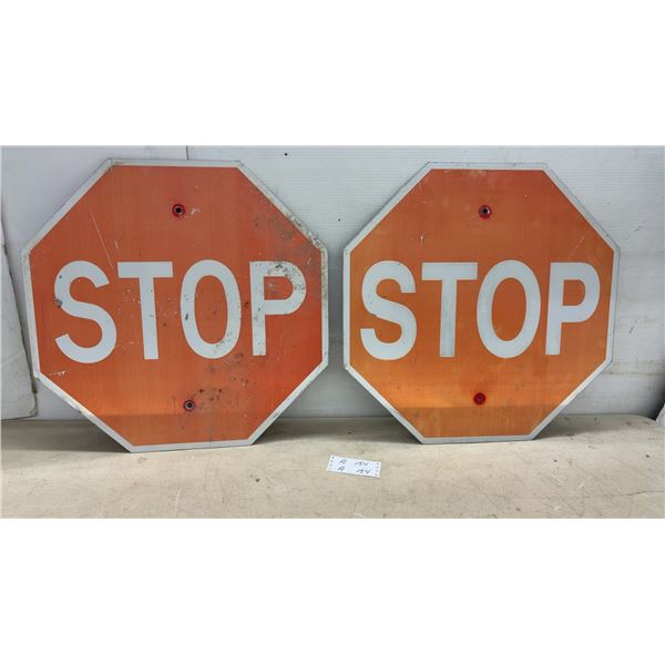 Two Metal Stop Signs