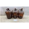 Image 1 : Three Vintage Javex Brown Glass Jugs with Cork Stoppers and Finger Loop Handles