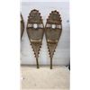 Image 2 : Two Pairs of Traditional Wooden Snowshoes with Rawhide Webbing and Red Pompom Accents