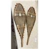 Image 4 : Two Pairs of Traditional Wooden Snowshoes with Rawhide Webbing and Red Pompom Accents