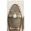 Image 6 : Two Pairs of Traditional Wooden Snowshoes with Rawhide Webbing and Red Pompom Accents