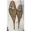Image 9 : Two Pairs of Traditional Wooden Snowshoes with Rawhide Webbing and Red Pompom Accents
