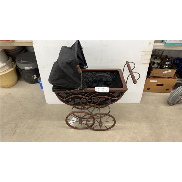 Vintage Victorian-Style Doll Pram with Scrollwork Metal Frame and Canopy